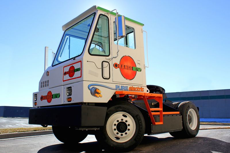 Orange EV electric terminal truck
